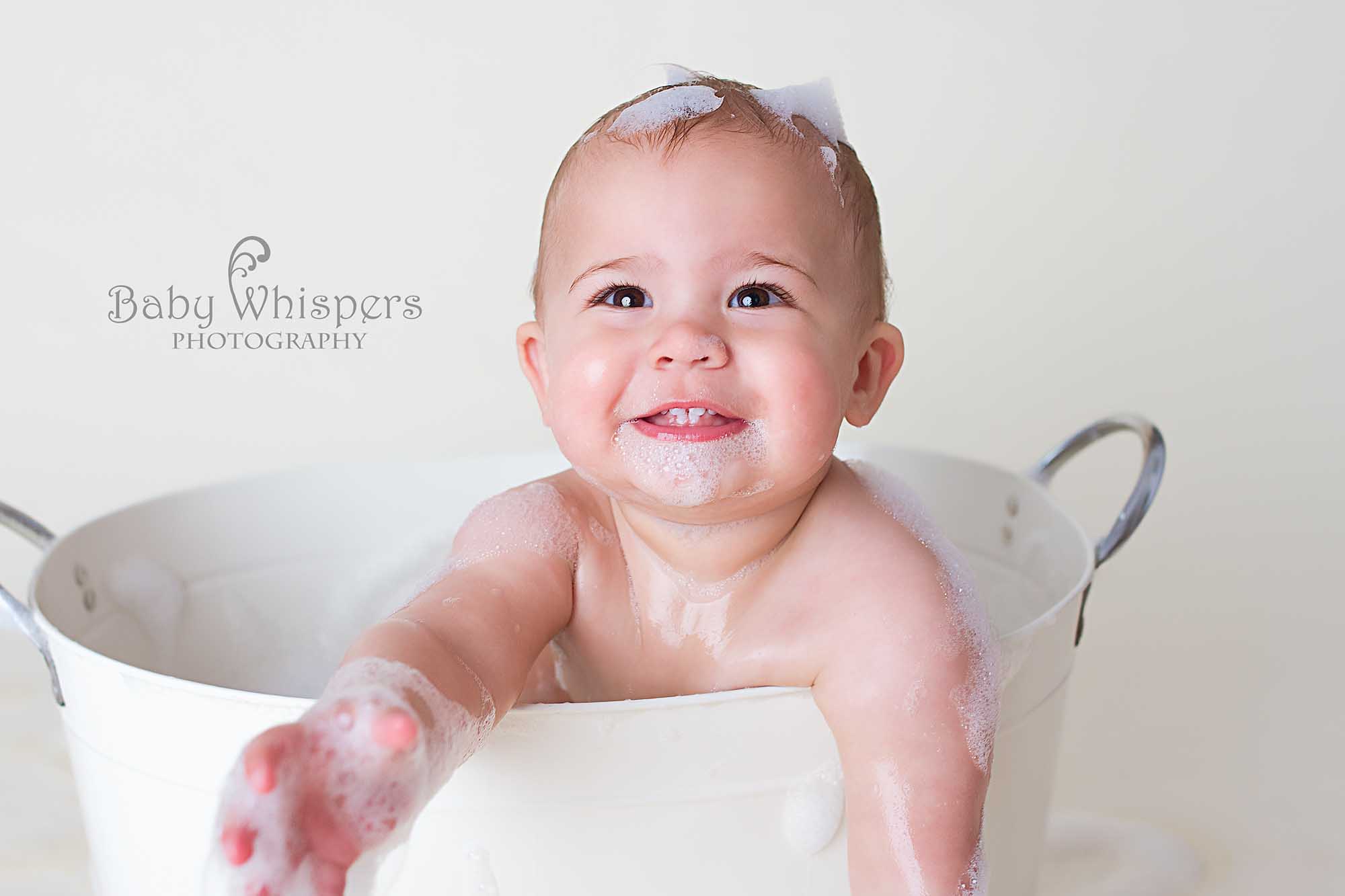 Baby Splashing in Bath Bubbles- Baby Whispers Photography Royston Hertsfordshire