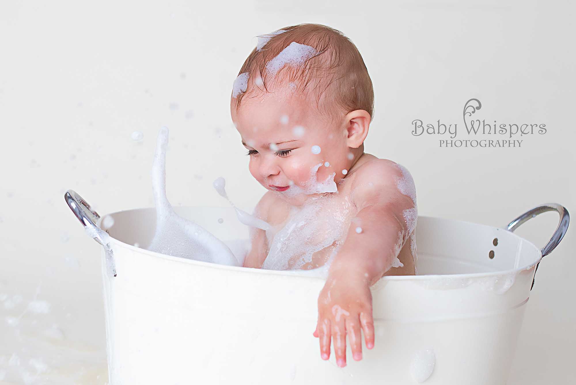 Baby Splashing in Bath Bubbles- Baby Whispers Photography Royston Herts